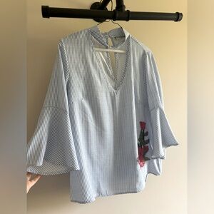 Choker neck blouse with appliqué. Like New. Size M. Blue and white stripe.